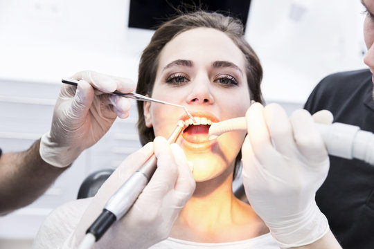 Young woman at the dentist receiving treatment