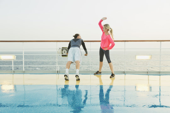 Couple doing light workout on a shipdeck, cruise ship, Mediterranean Sea