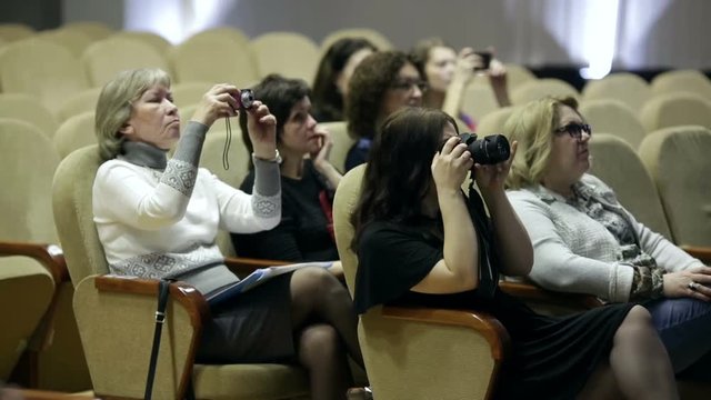Women taking pictures