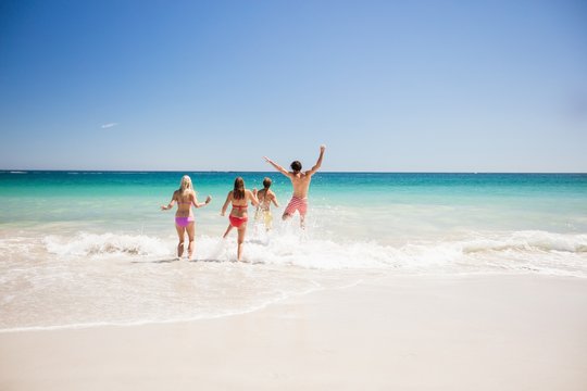  Friends having fun at the beach