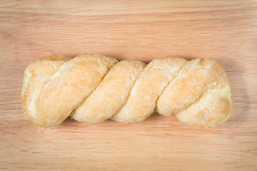 bread knead with sugar and butter on the wood background