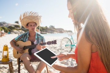 Fototapeta premium Friends lying and looking a tablet 