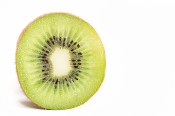 Cross section of ripe kiwi on white background