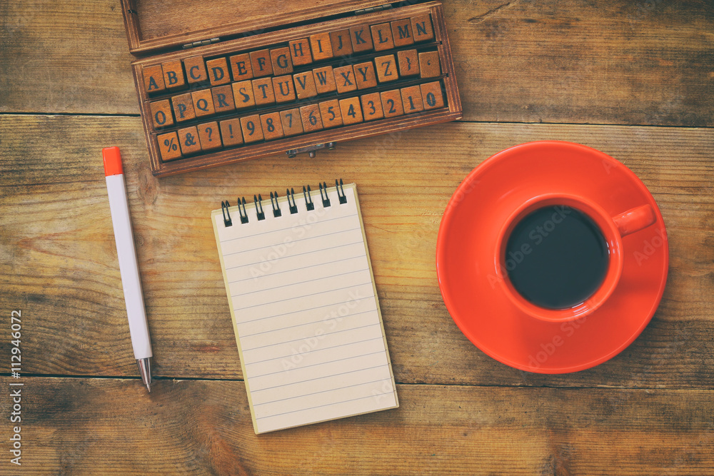 Poster open notebook with blank pages on wooden table