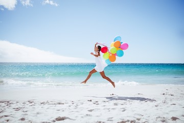  Beautiful woman holding balloon © WavebreakmediaMicro
