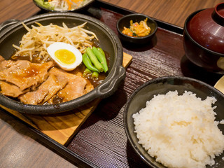 pork with egg and vegetables on hot plate