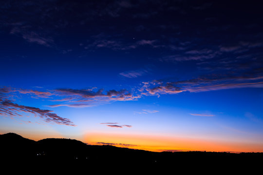 Fototapeta Sky at Sunrise, Landscape in Silhouette