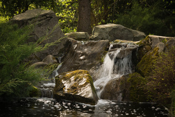 Naklejka na ściany i meble waterfall in the forest at summer