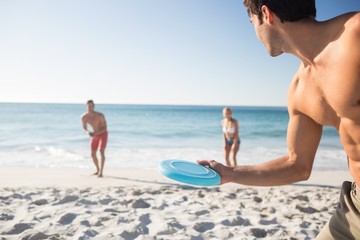 Friends playing with a frisbee