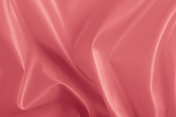 large folds on the  pearly pink fabric,  background