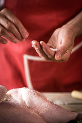 Unrecognizable woman cooking chicken