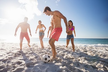 Friends playing football