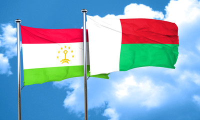 Tajikistan flag with Madagascar flag, 3D rendering