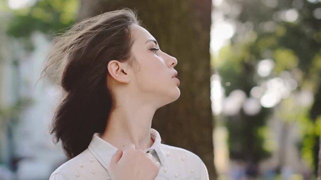 Beautiful Girl Teenager Running Hand Through Hair and Waiting for her Boyfriend