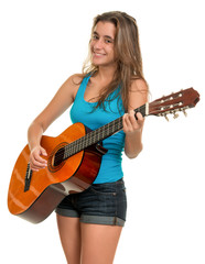 Hispanic teenage girl playing an acoustic guitar