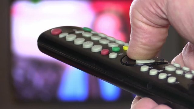 Watching TV and using remote controller 