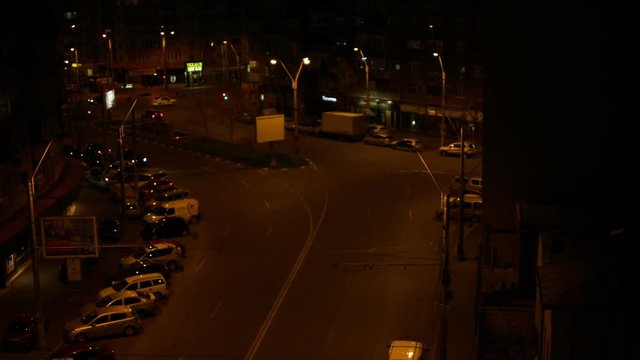 Aerial View Of A Street Late At Night, Pan, Night Traffic