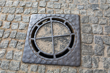 An old sewer manhole cover