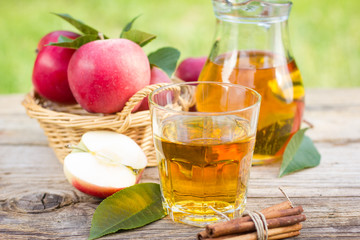 Apple juice in the glass and pitcher 
