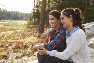 Happy lesbian couple relaxing in the countryside