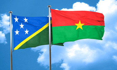 Solomon islands flag with Burkina Faso flag, 3D rendering