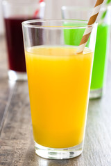 Fresh fruit smoothies on a rustic wooden table

