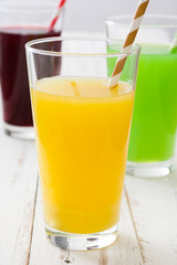 Fresh fruit smoothies on a white wooden background

