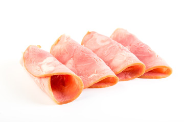 Fresh sliced smoked ham isolated on white background