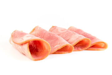 Fresh sliced smoked ham isolated on white background