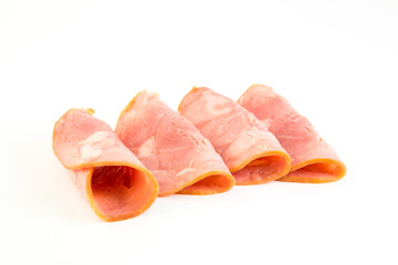 Fresh sliced smoked ham isolated on white background