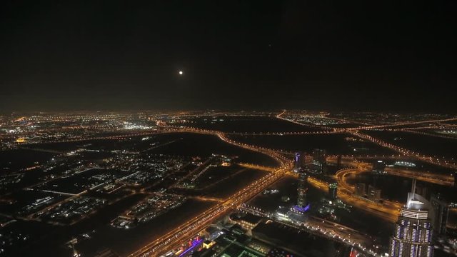 Dubai downtown at night, United Arab Emirates. View on Sheikh Zayed road from 124th floor of Burj Khalifa skyscraper in Dubai, currently the tallest structure in the world. At the top - Burj Khalifa