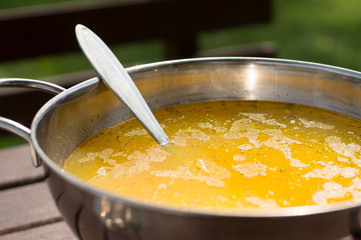 homemade soup in metal pot