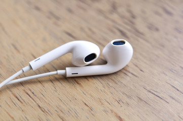 Digital Music White Headphones On Wood Table © wolfelarry