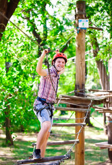 adventure climbing high wire park - people on course in mountain