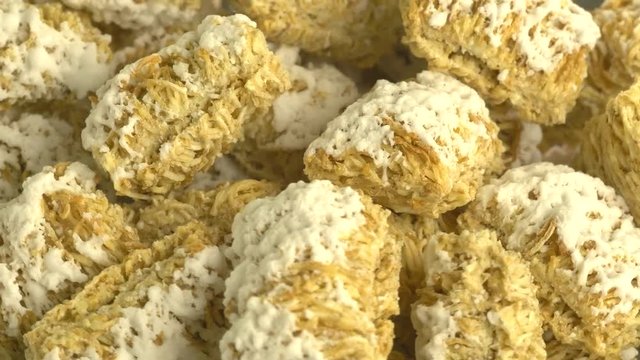 Cereals on a bowl rotating.