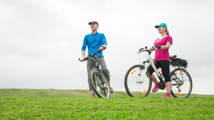 Fototapeta premium couple cycling outdoors