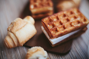waffles with a cherry on a wooden board