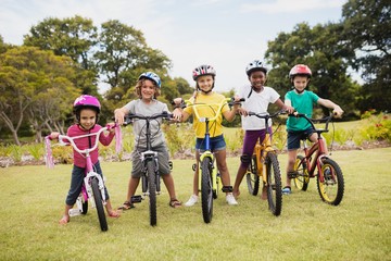 Children posing with bikes © WavebreakMediaMicro