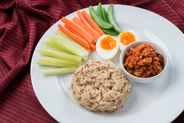 Foods series : Spicy chicken and tomato dip, served with brown rice, boiled egg and fresh vegetable, Thai foods, northern style