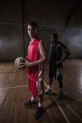 Fototapeta na wymiar Portrait of two basketball players posing