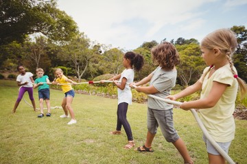  Children pulling a rope in tug of war 