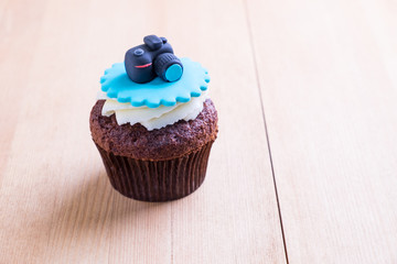 Delicious cupcake on table