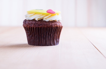 Delicious cupcake on table
