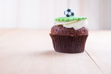 Delicious cupcake on table