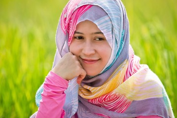 Muslim woman playing on paddy field in a village at Indonesia