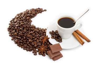 cup of coffee with cinnamon sticks, anise and chocolate