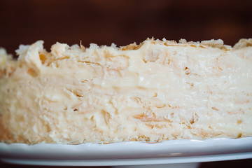 Napoleon cake on vintage wooden background