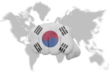 fist with the national flag of south korea on a world map background