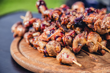 meat kebab skewers on the grill, chicken hearts,