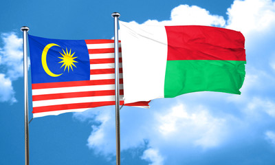 Malaysia flag with Madagascar flag, 3D rendering